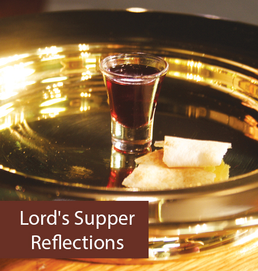 Communion elements on a tray: red wine in glass, piece of bread, with text Lord's Supper Reflections.