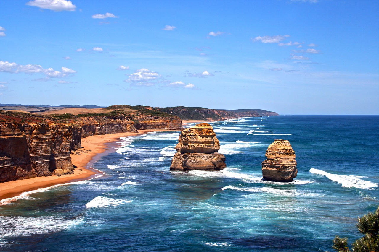 Stunning coastal view of rugged cliffs and ocean waves at Twelve Apostles, Great Ocean Road, Australia.