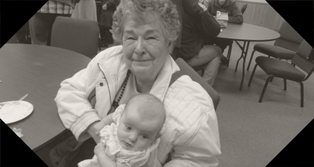 grandmother holding a baby