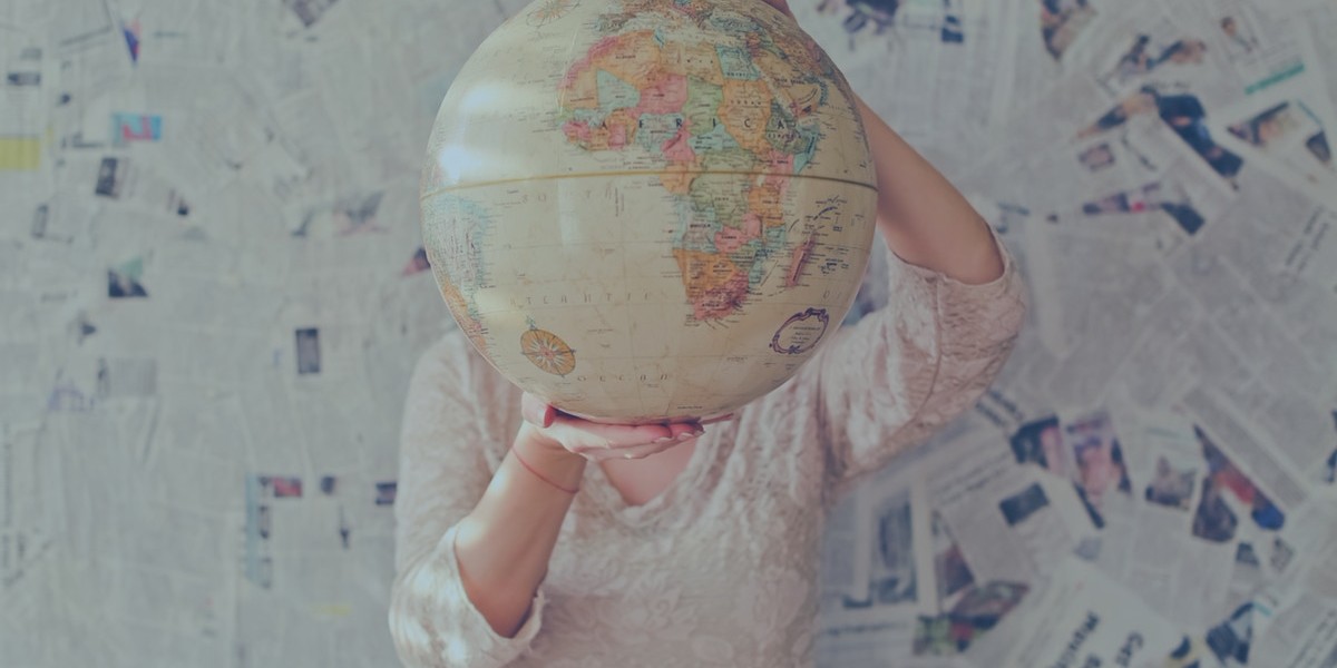 person holding a globe