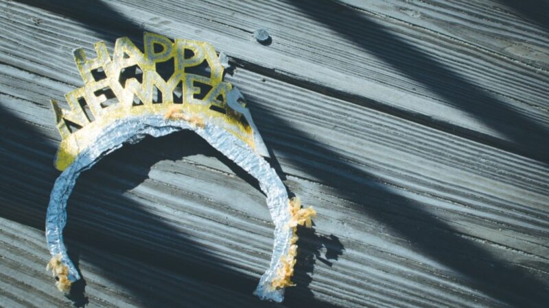 New Year's headband on wooden surface in sunlight.