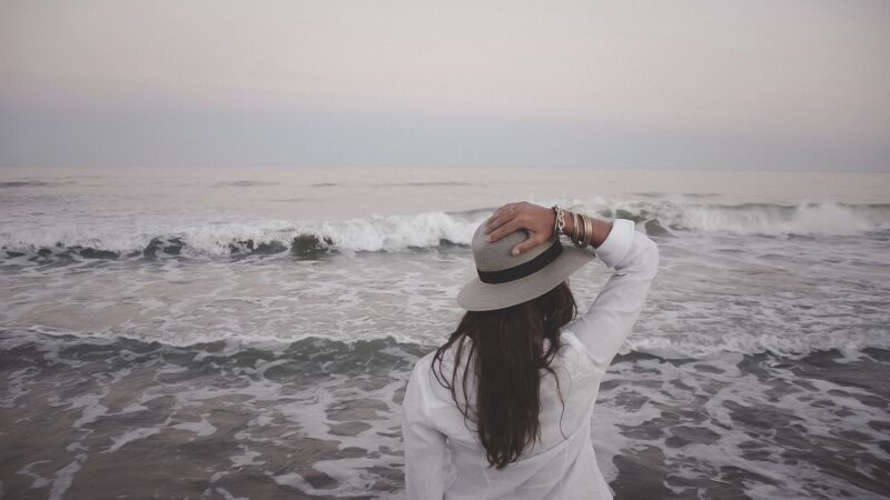person standing by a lake