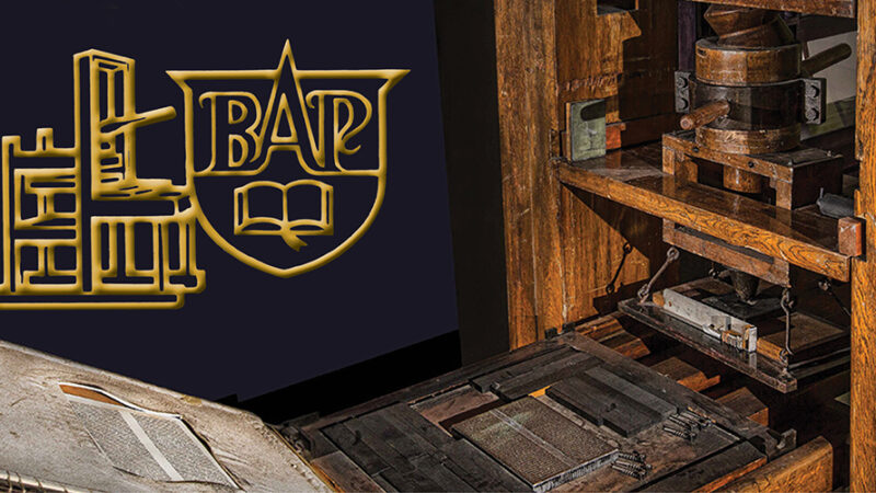 Vintage printing press and logo illustration on a dark background, showcasing historical publishing equipment.