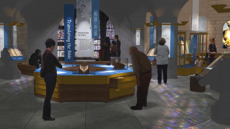 Museum exhibit on Bible translation history, featuring displays, artifacts, and visitors exploring the information.