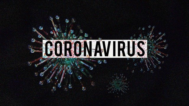Coronavirus illustration with labeled text, depicting virus particles on a dark background.
