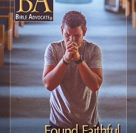 Man praying in a church aisle, cover of Bible Advocate magazine, January-February 2021 issue titled Found Faithful.