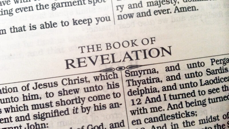 Open Bible page showing heading for the Book of Revelation with text references to Jesus Christ.
