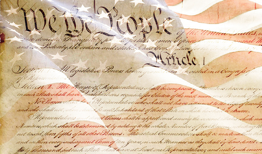 We the People text of U.S. Constitution overlaid on an American flag for a patriotic theme.