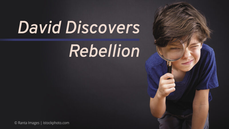Young boy with magnifying glass examines David Discovers Rebellion on black background, curious and playful expression.
