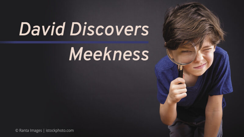 Boy examining with magnifying glass, caption David Discovers Meekness on a dark background.