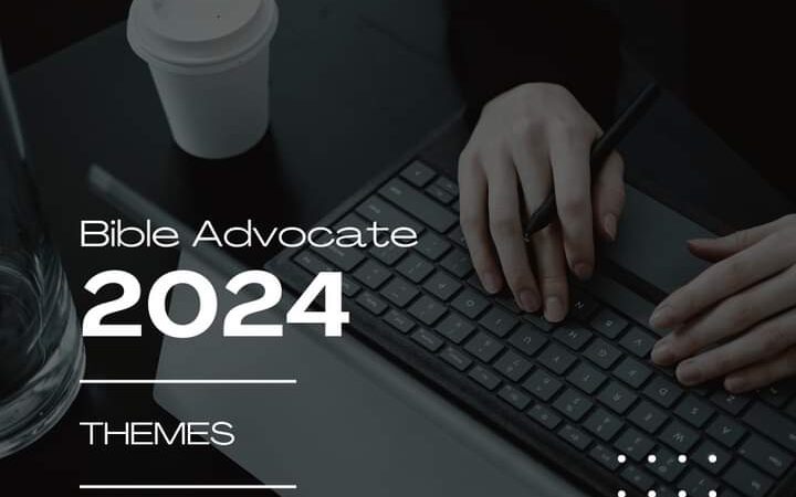 Person typing on keyboard with coffee, promoting Bible Advocate 2024 themes. Submit articles via email.