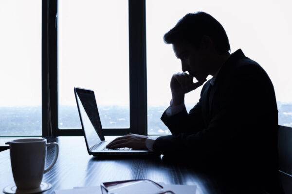 Businessman using laptop in the office