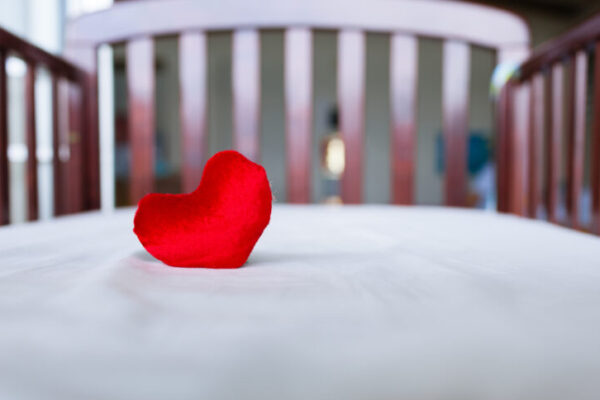 Heart in baby's crib